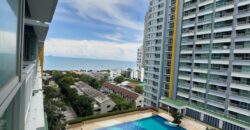 Full view of the pool and the sea from the balcony at Lumpini Park Beach Jomtien