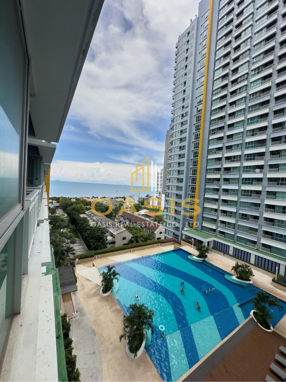 Full view of the pool and the sea from the balcony at Lumpini Park Beach Jomtien