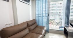Full view of the pool and the sea from the balcony at Lumpini Park Beach Jomtien
